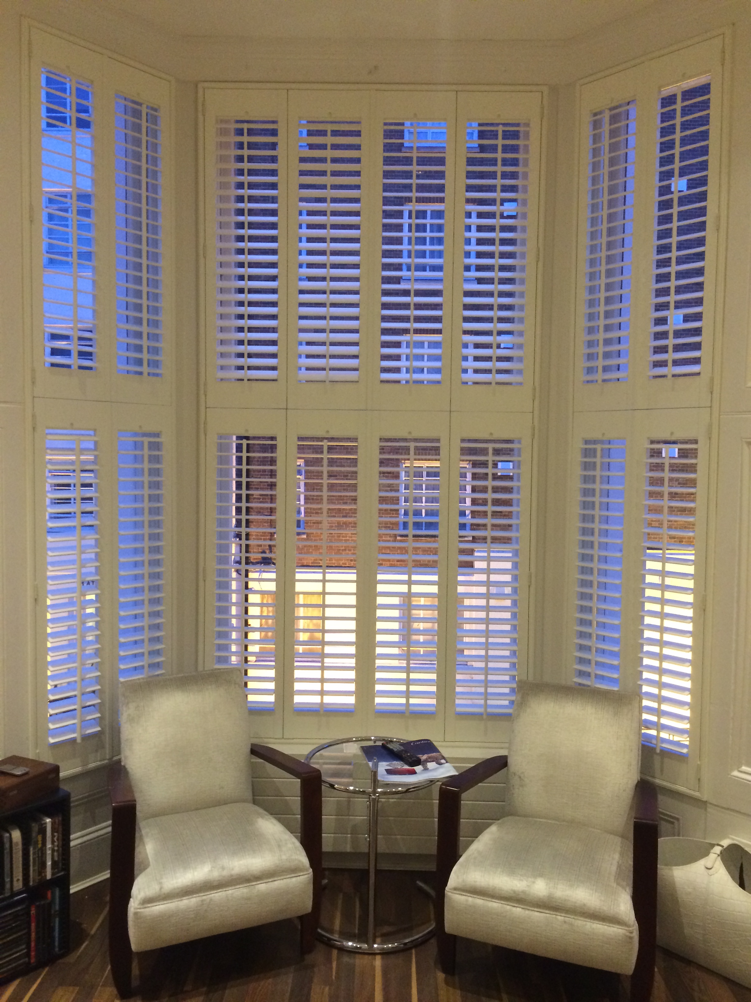 Tier on Tier hardwood shutters with a centre tilt-rod in West London